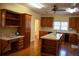 Spacious kitchen with island, wood cabinets, and hardwood floors at 95 Twin Lakes Dr, Carrollton, GA 30116