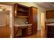 Built-in desk and ample wood cabinets in kitchen at 95 Twin Lakes Dr, Carrollton, GA 30116