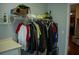 Laundry room with hanging clothes and shelving at 95 Twin Lakes Dr, Carrollton, GA 30116