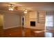 Living room with hardwood floors, fireplace, and built-in shelving at 95 Twin Lakes Dr, Carrollton, GA 30116