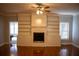 Spacious living room with hardwood floors, fireplace and built-in shelving at 95 Twin Lakes Dr, Carrollton, GA 30116