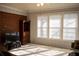 Living room with brick wall, large window, and hardwood floors at 95 Twin Lakes Dr, Carrollton, GA 30116