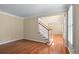 Bright living room with hardwood floors and staircase access at 2108 Kendall Close Nw, Acworth, GA 30102