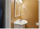 Small bathroom with white pedestal sink and mirror at 3135 Reeves St, Smyrna, GA 30080