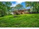 The backyard features a wooden deck and stairs, surrounded by lush greenery and trees at 6467 Joanna St, Lithia Springs, GA 30122