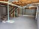 Unfinished basement with stairs and plumbing at 6467 Joanna St, Lithia Springs, GA 30122