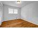 Neutral bedroom with hardwood floors at 6467 Joanna St, Lithia Springs, GA 30122