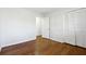 Simple bedroom with hardwood floors and built-in closet at 6467 Joanna St, Lithia Springs, GA 30122