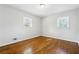 Spacious bedroom with hardwood floors and two windows at 6467 Joanna St, Lithia Springs, GA 30122
