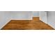 This bedroom features hardwood floors, neutral paint, and an open doorway at 6467 Joanna St, Lithia Springs, GA 30122