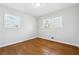 Spacious bedroom with hardwood floors and large windows at 6467 Joanna St, Lithia Springs, GA 30122