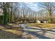 Ranch-style home with a large yard and wooded backdrop at 6467 Joanna St, Lithia Springs, GA 30122