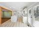 Bright kitchen features white cabinets, quartz counters and island, subway tile backsplash, and stainless sink at 6467 Joanna St, Lithia Springs, GA 30122