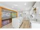 Bright kitchen features an island with white cabinets, countertops, and stainless steel appliances at 6467 Joanna St, Lithia Springs, GA 30122