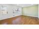 Living room with hardwood floors and large windows at 6467 Joanna St, Lithia Springs, GA 30122
