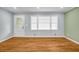 Hardwood floors and abundant natural light create a warm and inviting living space at 6467 Joanna St, Lithia Springs, GA 30122