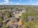 Wider aerial view of neighborhood and surrounding landscape at 1956 Spencer Oaks Ln, Lithonia, GA 30058