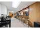 Basement bar with seating and mirrored back wall at 1956 Spencer Oaks Ln, Lithonia, GA 30058