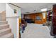 Basement stairs leading to a carpeted recreation area at 1956 Spencer Oaks Ln, Lithonia, GA 30058