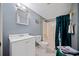 Basement bathroom with shower/tub combo, toilet, and vanity at 1956 Spencer Oaks Ln, Lithonia, GA 30058