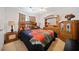 Main bedroom with a queen bed and wood furniture set at 1956 Spencer Oaks Ln, Lithonia, GA 30058
