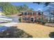 Brick house with a two-car garage and boat at 1956 Spencer Oaks Ln, Lithonia, GA 30058