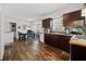 Kitchen with dark cabinets and wood-look flooring at 1956 Spencer Oaks Ln, Lithonia, GA 30058