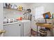 Laundry room with washer, dryer, and ample shelving at 1956 Spencer Oaks Ln, Lithonia, GA 30058