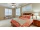 Spacious basement bedroom with window and cozy seating area at 3323 Glen Devon Ln, Berkeley Lake, GA 30096