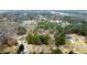 Wide aerial view of neighborhood and surrounding area at 3570 Knoll Crest Trl, Buford, GA 30519