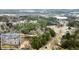 Aerial view showcasing a two-story house nestled in a wooded neighborhood at 3570 Knoll Crest Trl, Buford, GA 30519