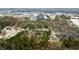 Aerial view showing a residential neighborhood with houses and trees at 3570 Knoll Crest Trl, Buford, GA 30519