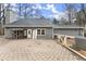 Home's back patio with paver stones and a fenced yard at 3570 Knoll Crest Trl, Buford, GA 30519