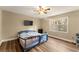 Large bedroom with a king-size bed and a baby gate at 3570 Knoll Crest Trl, Buford, GA 30519