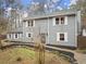 Two-story gray house, white shutters, stone accents, and a walkway at 3570 Knoll Crest Trl, Buford, GA 30519