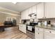 Bright kitchen with granite countertops and stainless steel appliances at 3570 Knoll Crest Trl, Buford, GA 30519