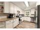 Updated kitchen with granite counters and stainless steel appliances at 3570 Knoll Crest Trl, Buford, GA 30519