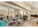 Bright living area with soaring ceilings, elegant lighting, and beautiful wood floors at 3570 Knoll Crest Trl, Buford, GA 30519