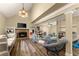 Gathering room with a fireplace and built-in shelving at 3570 Knoll Crest Trl, Buford, GA 30519