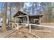 Detached workshop with covered porch and fenced yard at 3570 Knoll Crest Trl, Buford, GA 30519