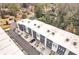 Aerial view of modern townhouses with private driveways and lush landscaping at 1107 Briar Cove Cir, Atlanta, GA 30329