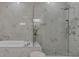 Large walk-in shower with marble tile and glass enclosure at 1107 Briar Cove Cir, Atlanta, GA 30329