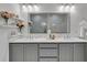 Double vanity bathroom with gray cabinets and quartz countertops at 1107 Briar Cove Cir, Atlanta, GA 30329