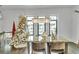 Elegant dining room with glass-top table, chandelier, and hardwood floors at 1107 Briar Cove Cir, Atlanta, GA 30329