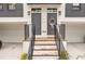 Townhome entrance with gray doors and brick steps at 1107 Briar Cove Cir, Atlanta, GA 30329