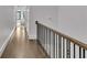 Long hallway with hardwood floors and access to bedrooms at 1107 Briar Cove Cir, Atlanta, GA 30329