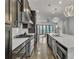 Modern kitchen with island, stainless steel appliances and hardwood floors at 1107 Briar Cove Cir, Atlanta, GA 30329