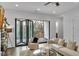 Bright living room with folding glass doors leading to a balcony at 1107 Briar Cove Cir, Atlanta, GA 30329