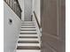 Modern staircase with dark wood steps and white risers at 1107 Briar Cove Cir, Atlanta, GA 30329