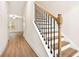 Elegant staircase with wood railing and metal spindles at 11118 Benton, Covington, GA 30014